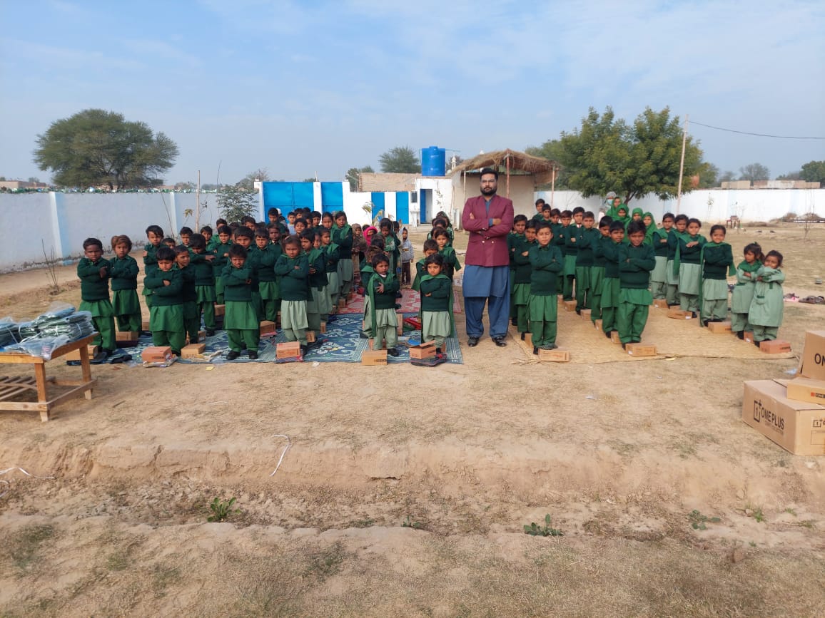 Students celebrating with educational supplies